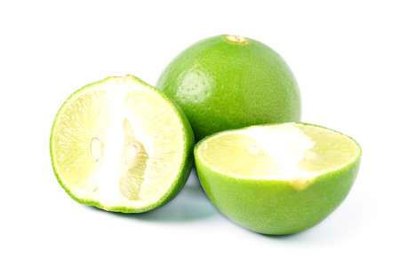 Natural fresh lime and sliced, green leaf isolated on white background