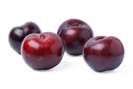 Fresh three red plums fruit isolated on white background.の写真素材