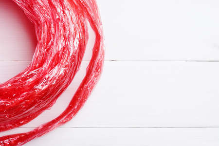 flat lay red straw rope isolated on white table background. top view.