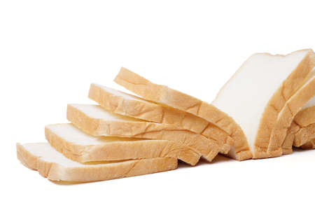 Slices of fresh delicious bread isolated on a white background. Close up image of cut of loaf bread....