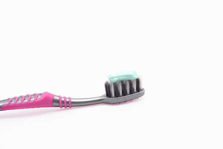 toothbrushes isolated on the white background. amount of toothpaste is applied to the of...