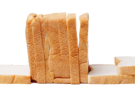Fresh delicious whole wheat bread isolated on a white background. image of cut of loaf bread.の写真素材