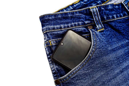 Denim blue jeans fabric with smartphone. Ripped denim blue cloth background, text place, copy space....