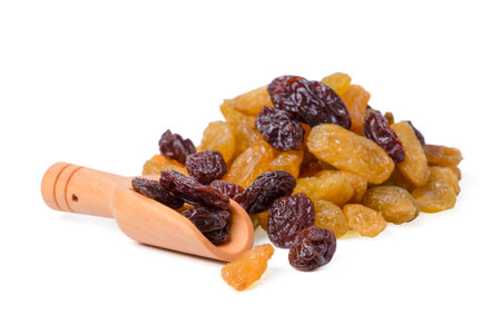 Isolated dried grapes. yellow and black is the highest grade on white background. with cliping path.の写真素材