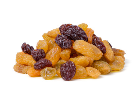 Isolated dried grapes. yellow and black is the highest grade on white background. with cliping path.の写真素材