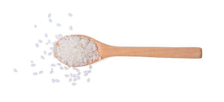 Isolated raw rice. Top view raw rice japanese in wooden spoon on white background. asian white rice or uncooked.の写真素材