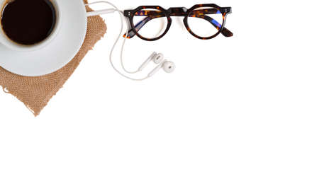 Top view gray concrete table office desk top with white cup coffee, eye glasses, supplies. with copy space. clipping path.の写真素材