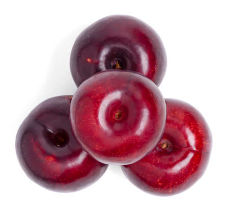 Isolated plums fruit. Top view fresh red plums fruit on white background. clipping pathの写真素材