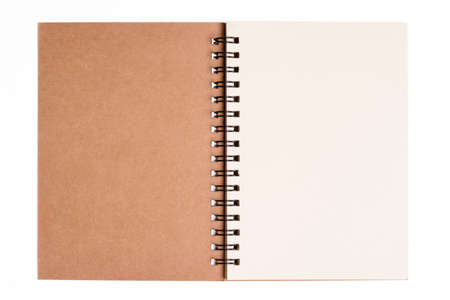 Isolated notebook. Top view of spiral kraft notebook front, open page on background for mockupの写真素材