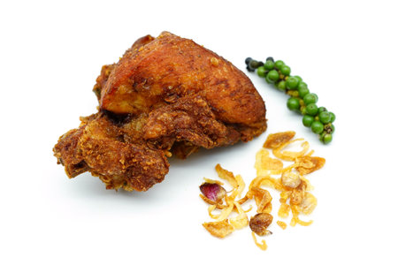 Fried chicken isolated on white background. Thai style Sticky rice with fried chicken with Fresh pepper and Fried garlic.の写真素材