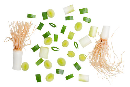 Isolated chopped fresh. Top view slice spring onions with root on white background.の写真素材