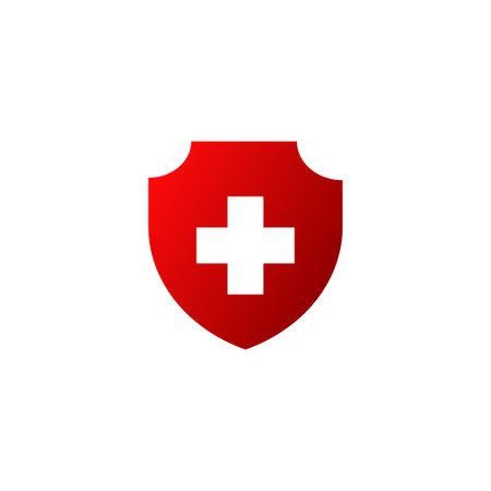 Red shield with cross icon. Providing first aid to patients and their protection symbol and development of vector medicalのイラスト素材