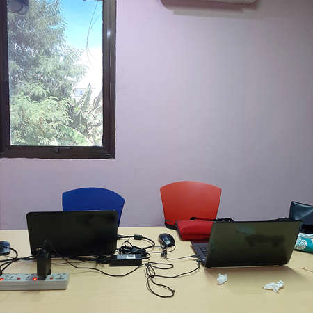 Two chairs and two laptops
-DL-