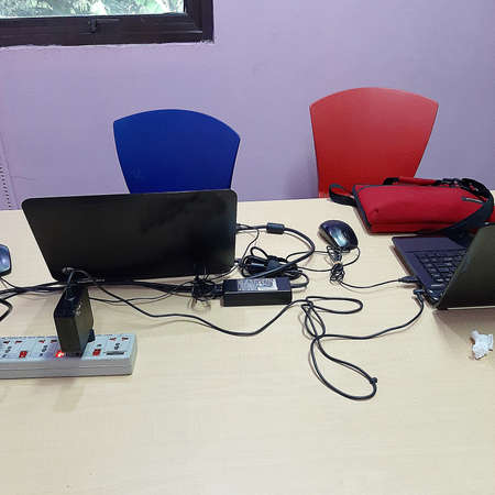 Two chairs and two laptops
-DL-