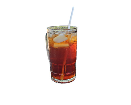 Tea with ice cubes and straw isolated on white background with clipping pathの写真素材