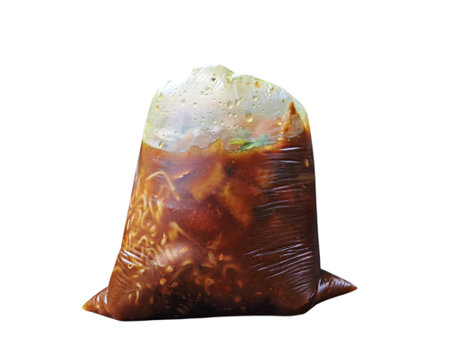 Soup wrapped in plastic. Plastic isolated on white background. Tofu tahu campur food indonesian. tofu tahu campur food culinary.の写真素材
