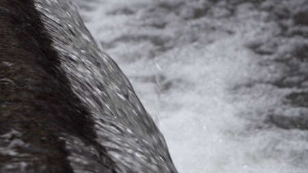 Closeup of waterfall on drain sewer system with focus transitionの写真素材