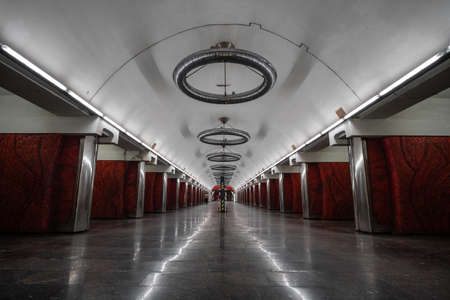 Palats "Ukrayina" subway metro station with blue soviet train. Interior of the deep pylon station.のeditorial素材