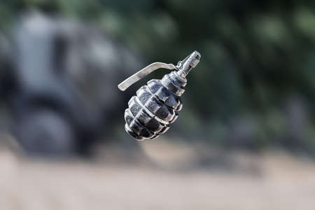 Grenade in flight. F1 grenade in flight with motion blurred background.の写真素材