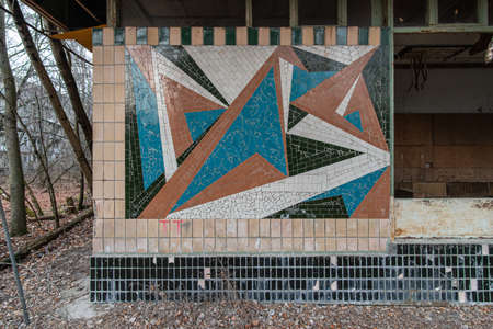 Abstract mosaic on an abandoned department store in the city of Pripyat. Pripyat, Ukraine - November 28, 2021.のeditorial素材