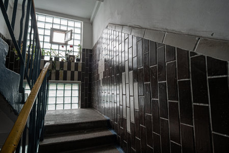Interior of a dark staircase case of an old Soviet panel house called Khrushchevka. Kyiv, Ukraine - May. 2021のeditorial素材