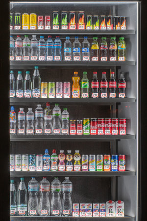 Showcase of a Ukrainian kiosk with water, juices and energy drinks at night. Kyiv, Ukraine - Apr. 2021のeditorial素材