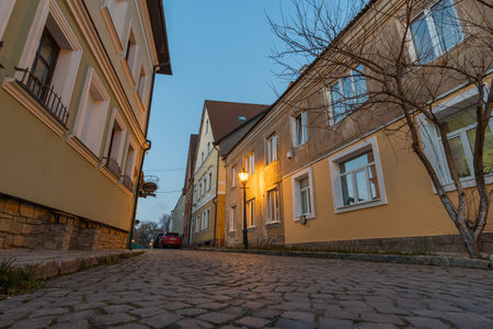 Old medieval European street. Piatnytska street, Kamyanets-Podilsky old town, Ukraine. Kamianets-Podilskyi, Khmelnytsky oblast, Ukraine - November, 2021.のeditorial素材