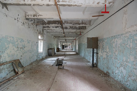 A long abandoned communication corridor of an old Soviet over-the-horizon radar station called the Arc. Chernobyl, Ukraine - November 2021.のeditorial素材