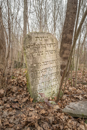 Ancient Jewish abandoned tombstone grave. Kamianets-Podilskyi, Ukraine - 2022.のeditorial素材