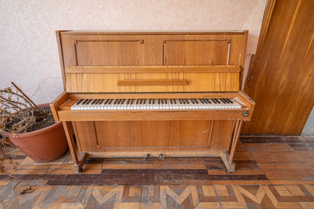 Old abandoned wooden Soviet piano. Borodyanka, Kyiv region, Ukraine. - may, 2022.のeditorial素材
