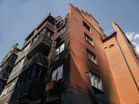 A burnt-out residential building after the Russian attack. Kyiv, Irpin - June, 2022.のeditorial素材