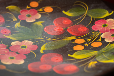 Petrykivka painting on a wood, close-up. Petrykivka painting is a traditional Ukrainian decorative painting style. Kyiv, Ukraine - Jul 5, 2022.のeditorial素材
