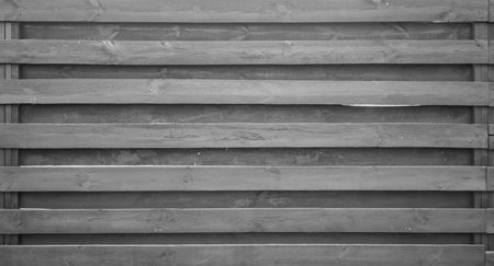 Gray fence made of boards, textured.の写真素材