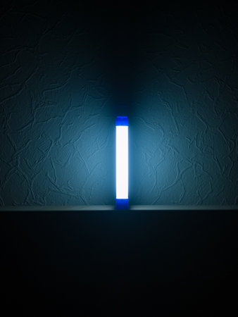 Cold LED backup emergency light in the apartment in the dark.
