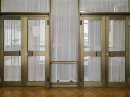 Wall with glass panels framed by aluminium in the interior of the 1980s in the style of Soviet...