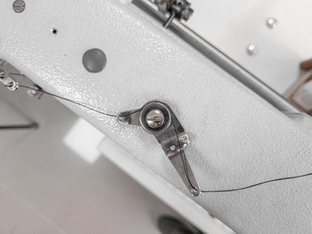 Element of sewing machine, stretching mechanism for rope, close-up macro.