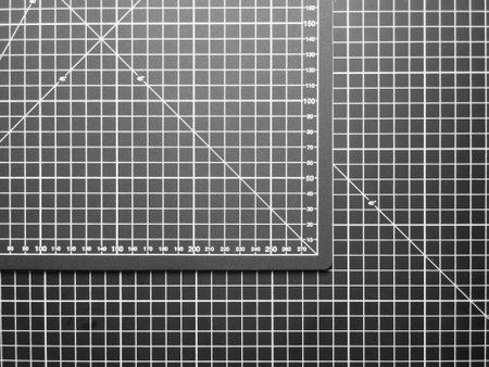 Black and white cutting mat with grid and numbers, top view.の写真素材