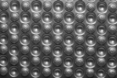 Abstract texture of bubbles covered with aluminum foil.  Covering the bottom of the cage.の写真素材