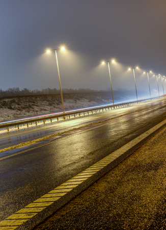Wet highway in the early morningの写真素材