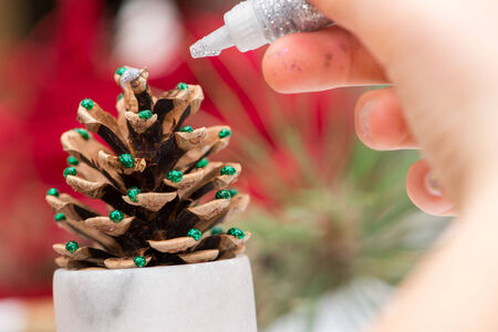 Young girl making her own christmas decorationの写真素材