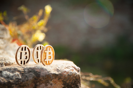 Bit coin on the old stone and brick wallの写真素材