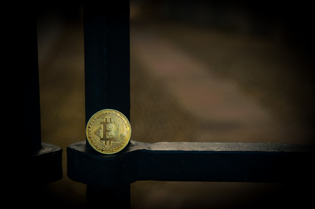 Bit coin on steel gate
