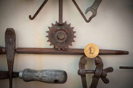 Bit coin with different tools on wallの写真素材