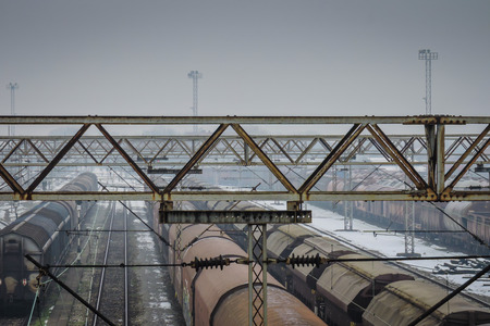 Railroad station in winter time with old tracksの写真素材