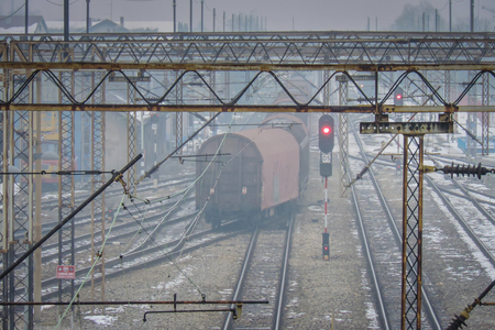 Railroad station in winter time with old tracksの写真素材
