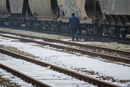 Slavonski Brod, Croatia 1/31/2019: Train station covered with snow with foggy dayのeditorial素材