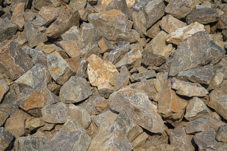 Textured background, stone red color, stacked on pileの写真素材