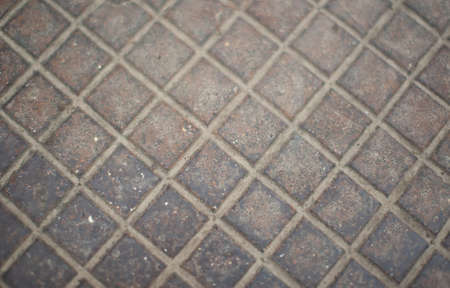 Iron cover with a true symmetrical checkered pattern as a texture.の写真素材