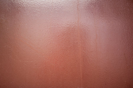 Texture with brown metallic color and painted background with an interesting pattern.の写真素材