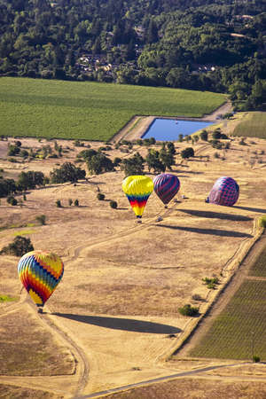 Aerial view of colorful hot air balloons on the ground in Napa, California, USAの写真素材